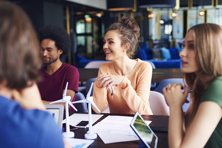 Group of coworkers talking at conference table 