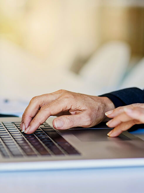 Closeup view of environmental engineering consultant working on computer