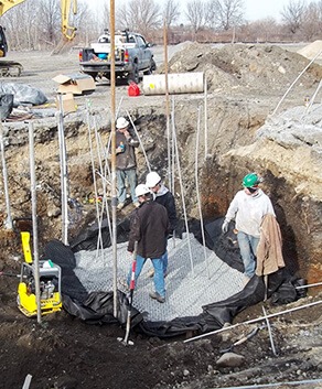 Group of environmental and geotechnical engineering consultants working on site