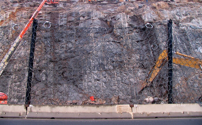 Rock engineering project site set up with net to avoid hazardous rockfall