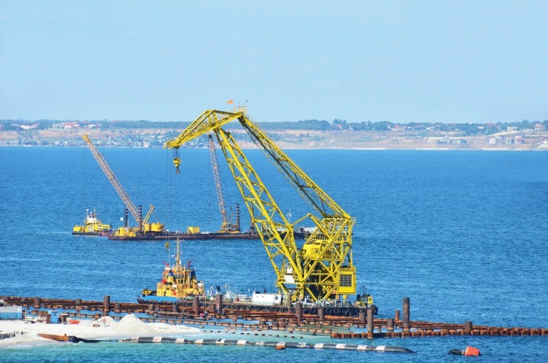 Engineering equipment in use at a port on the water