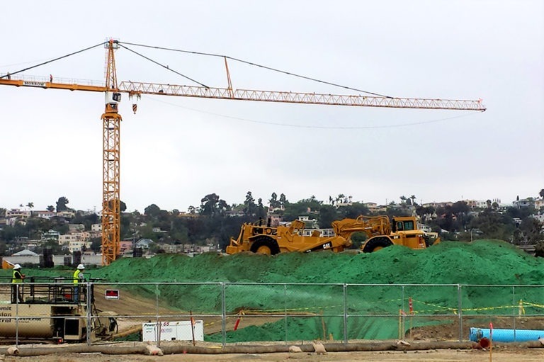 Stockpiles sprayed with bonded fiber matrix to provide stabilization during rainy season.