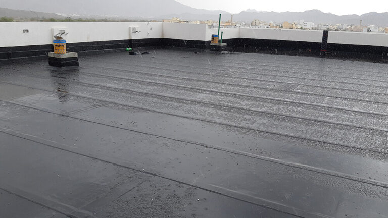 Rain falling on a large, flat roof